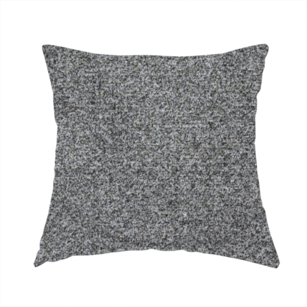 The fabric used to create this handmade cushion is a multi-toned charcoal grey and silver textured upholstery fabric.
