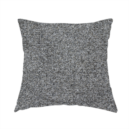 The fabric used to create this handmade cushion is a multi-toned charcoal grey and silver textured upholstery fabric.