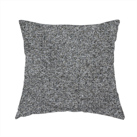 The fabric used to create this handmade cushion is a multi-toned charcoal grey and silver textured upholstery fabric.