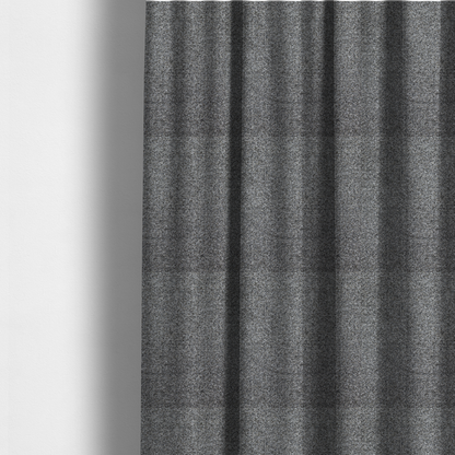 The fabric used to create these made-to-measure curtains is a multi-toned charcoal grey and silver textured upholstery fabric.