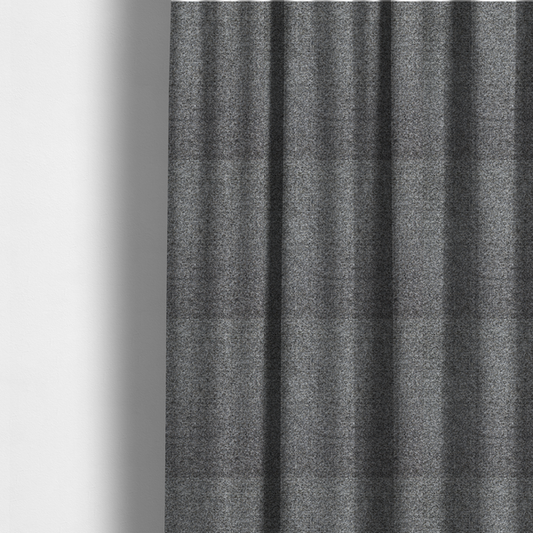 The fabric used to create these made-to-measure curtains is a multi-toned charcoal grey and silver textured upholstery fabric.