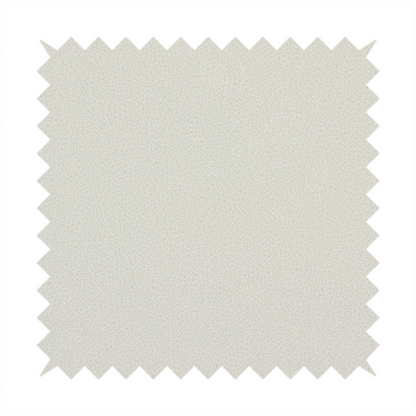 A light beige or off-white suede fabric. The textile features a highly detailed, dense, and uniform embossed pebbled pattern, giving the soft suede material an intricate, tactile texture reminiscent of shagreen.