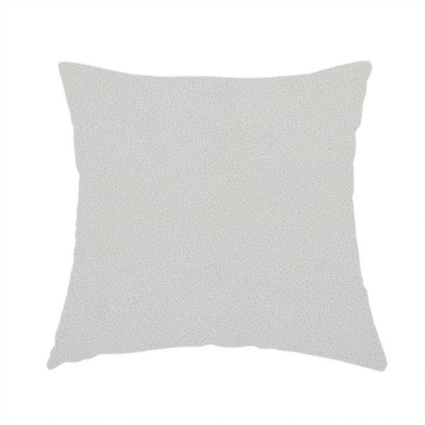 The fabric used to create this handmade cushion is a light grey Merida Suede upholstery fabric. The textile features a highly detailed, dense, and uniform embossed pebbled pattern, giving the soft grey suede material an intricate, tactile shagreen texture.