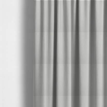 The fabric used to create these made-to-measure curtains is a light grey Merida Suede upholstery fabric. The textile features a highly detailed, dense, and uniform embossed pebbled pattern, giving the soft grey suede material an intricate, tactile shagreen texture.