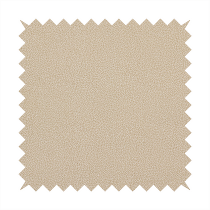 A warm beige or tan Merida Suede upholstery fabric. The textile features a highly detailed, dense, and uniform embossed pebbled pattern, giving the soft suede material an intricate, tactile shagreen texture.