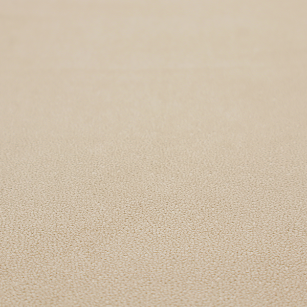 A warm beige or tan Merida Suede upholstery fabric. The textile features a highly detailed, dense, and uniform embossed pebbled pattern, giving the soft suede material an intricate, tactile shagreen texture.