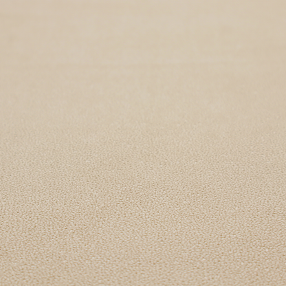 A warm beige or tan Merida Suede upholstery fabric. The textile features a highly detailed, dense, and uniform embossed pebbled pattern, giving the soft suede material an intricate, tactile shagreen texture.