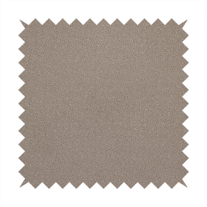 A taupe or dark beige Merida Suede upholstery fabric. The textile features a highly detailed, dense, and uniform embossed pebbled pattern, giving the soft suede material an intricate, tactile shagreen texture.