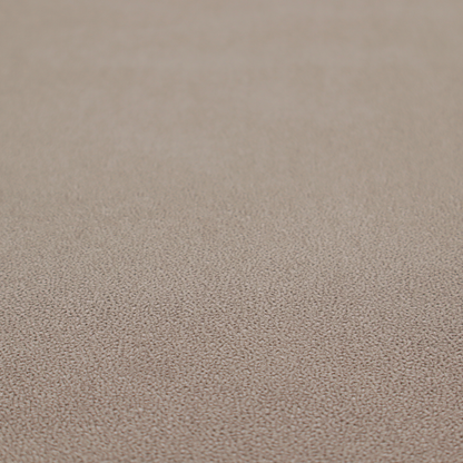A taupe or dark beige Merida Suede upholstery fabric. The textile features a highly detailed, dense, and uniform embossed pebbled pattern, giving the soft suede material an intricate, tactile shagreen texture.