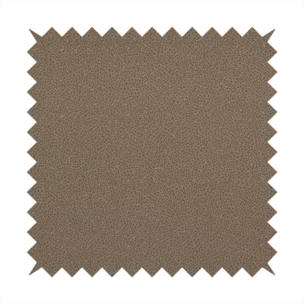 A medium brown Merida Suede upholstery fabric. The textile features a highly detailed, dense, and uniform embossed pebbled pattern, giving the soft suede material an intricate, tactile shagreen texture.