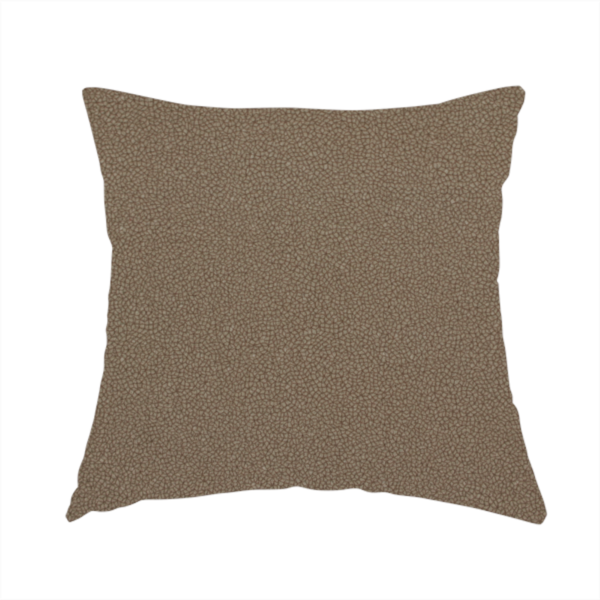The fabric used to create this handmade cushion is a medium brown Merida Suede upholstery fabric. The textile features a highly detailed, dense, and uniform embossed pebbled pattern, giving the soft suede material an intricate, tactile shagreen texture.