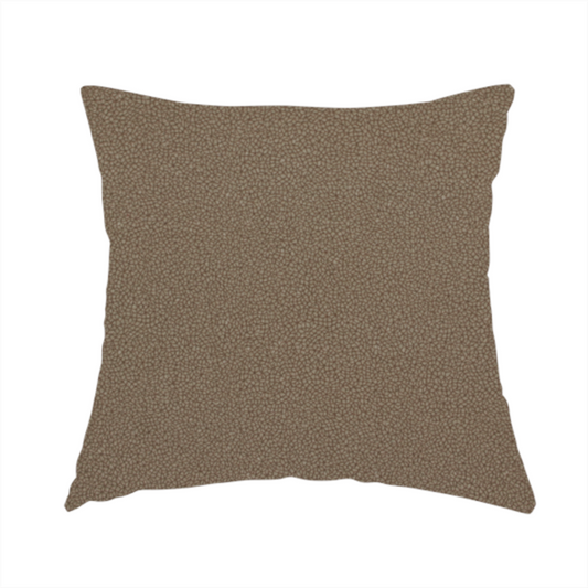 The fabric used to create this handmade cushion is a medium brown Merida Suede upholstery fabric. The textile features a highly detailed, dense, and uniform embossed pebbled pattern, giving the soft suede material an intricate, tactile shagreen texture.