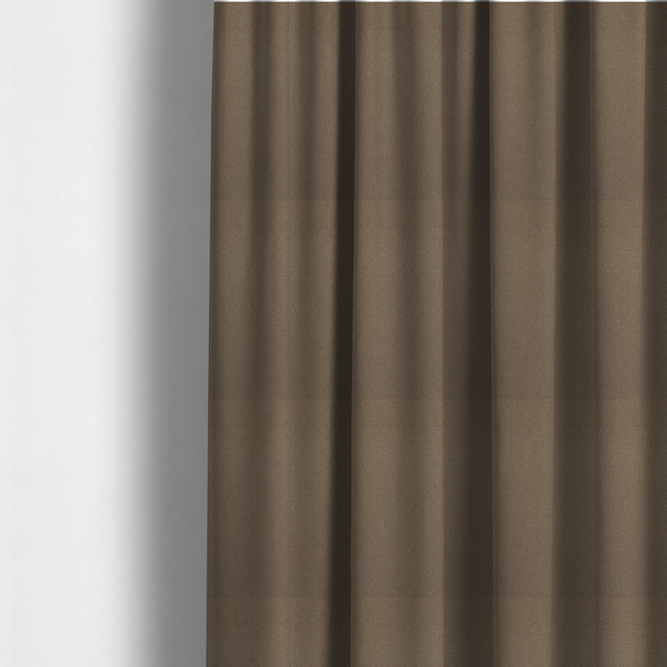 The fabric used to create these made-to-measure curtains is a medium brown Merida Suede upholstery fabric. The textile features a highly detailed, dense, and uniform embossed pebbled pattern, giving the soft suede material an intricate, tactile shagreen texture.