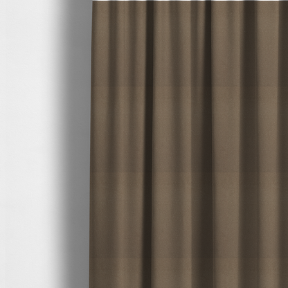 The fabric used to create these made-to-measure curtains is a medium brown Merida Suede upholstery fabric. The textile features a highly detailed, dense, and uniform embossed pebbled pattern, giving the soft suede material an intricate, tactile shagreen texture.