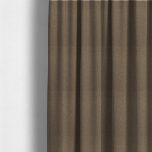 The fabric used to create these made-to-measure curtains is a medium brown Merida Suede upholstery fabric. The textile features a highly detailed, dense, and uniform embossed pebbled pattern, giving the soft suede material an intricate, tactile shagreen texture.