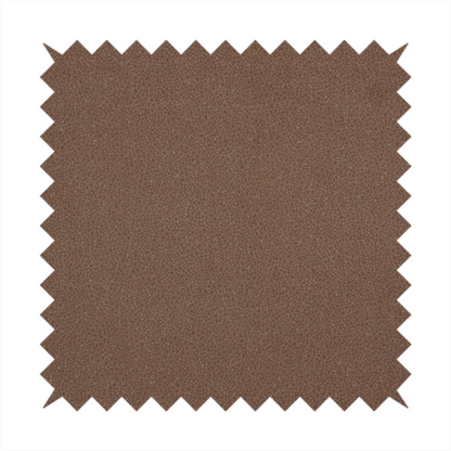 A dark brown or chestnut Merida Suede upholstery fabric. The textile features a highly detailed, dense, and uniform embossed pebbled pattern, giving the soft suede material an intricate, tactile shagreen texture.