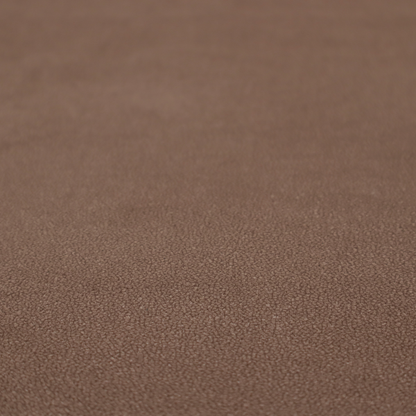 A dark brown or chestnut Merida Suede upholstery fabric. The textile features a highly detailed, dense, and uniform embossed pebbled pattern, giving the soft suede material an intricate, tactile shagreen texture.