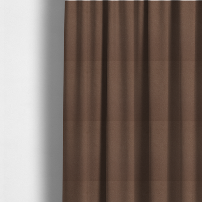 The fabric used to create these made-to-measure curtains is a dark brown or chestnut Merida Suede upholstery fabric. The textile features a highly detailed, dense, and uniform embossed pebbled pattern, giving the soft suede material an intricate, tactile shagreen texture.