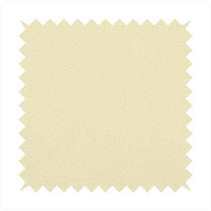 A light cream or soft ivory Merida Suede upholstery fabric. The textile features a highly detailed, dense, and uniform embossed pebbled pattern, giving the soft suede material an intricate, tactile shagreen texture.