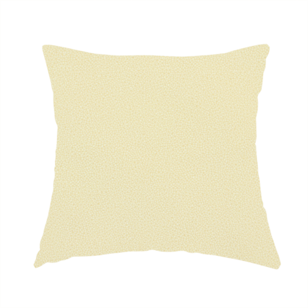 The fabric used to create this handmade cushion is a light cream or soft ivory Merida Suede upholstery fabric. The textile features a highly detailed, dense, and uniform embossed pebbled pattern, giving the soft suede material an intricate, tactile shagreen texture.