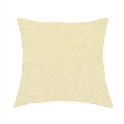 The fabric used to create this handmade cushion is a light cream or soft ivory Merida Suede upholstery fabric. The textile features a highly detailed, dense, and uniform embossed pebbled pattern, giving the soft suede material an intricate, tactile shagreen texture.