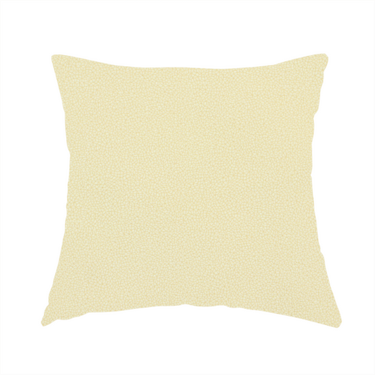 The fabric used to create this handmade cushion is a light cream or soft ivory Merida Suede upholstery fabric. The textile features a highly detailed, dense, and uniform embossed pebbled pattern, giving the soft suede material an intricate, tactile shagreen texture.