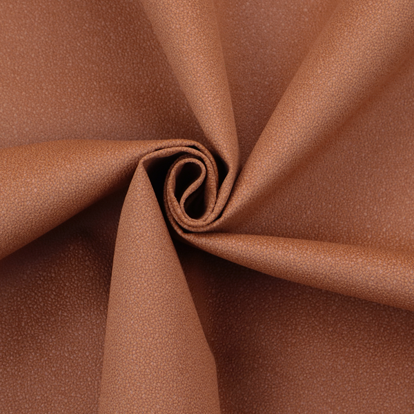 A warm terracotta or rust orange Merida Suede upholstery fabric. The textile features a highly detailed, dense, and uniform embossed pebbled pattern, giving the soft suede material an intricate, tactile shagreen texture.