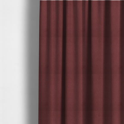 The fabric used to create these made-to-measure curtains is a suede fabric in a deep, muted maroon or burgundy colour.