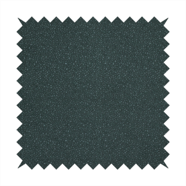 A Merida Suede upholstery fabric in a deep, dark teal or charcoal green colour.