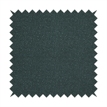 A Merida Suede upholstery fabric in a deep, dark teal or charcoal green colour.