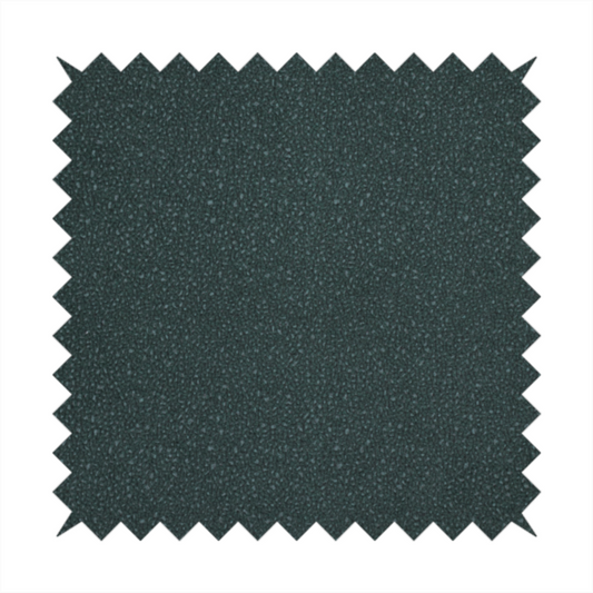 A Merida Suede upholstery fabric in a deep, dark teal or charcoal green colour.