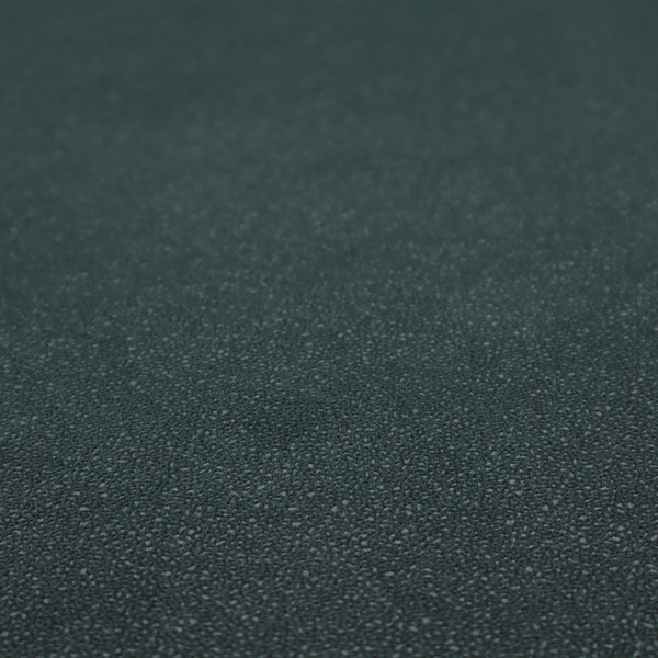 A Merida Suede upholstery fabric in a deep, dark teal or charcoal green colour.