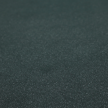A Merida Suede upholstery fabric in a deep, dark teal or charcoal green colour.