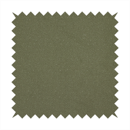 A Merida Suede upholstery fabric in a muted olive green or sage colour.