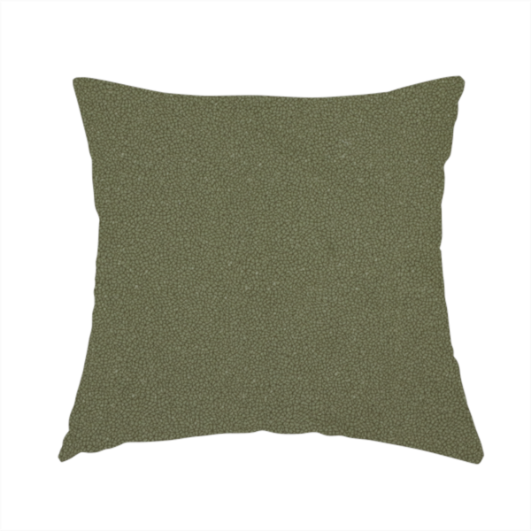 The fabric used to create this handmade cushion is a Merida Suede upholstery fabric in a muted olive green or sage colour.