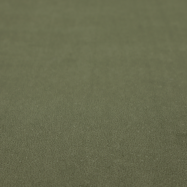 A Merida Suede upholstery fabric in a muted olive green or sage colour.