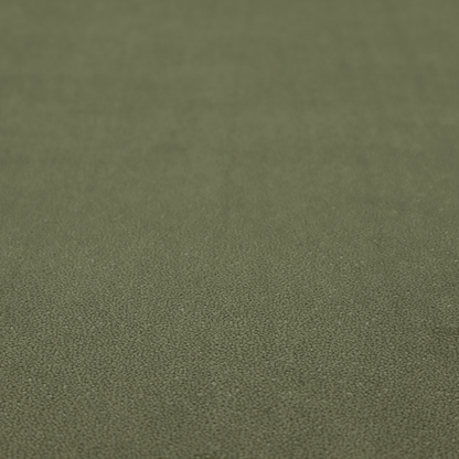 A Merida Suede upholstery fabric in a muted olive green or sage colour.