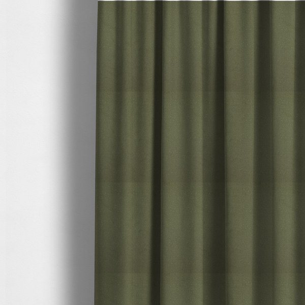 The fabric used to create these made-to-measure curtains is a Merida Suede upholstery fabric in a muted olive green or sage colour.