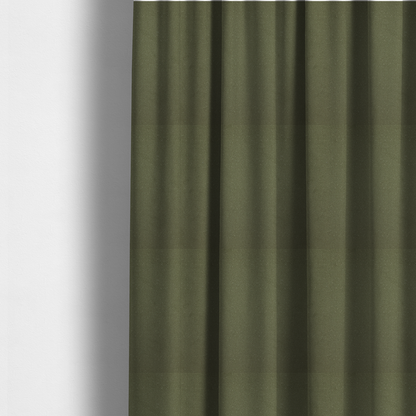 The fabric used to create these made-to-measure curtains is a Merida Suede upholstery fabric in a muted olive green or sage colour.