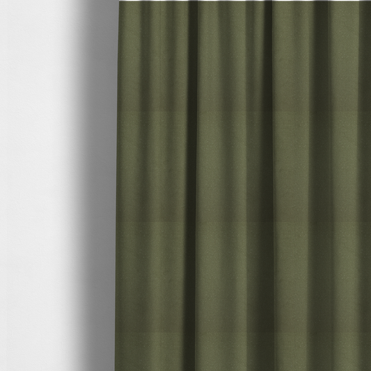 The fabric used to create these made-to-measure curtains is a Merida Suede upholstery fabric in a muted olive green or sage colour.