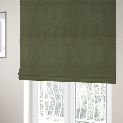 The fabric used to create these Roman blinds is a Merida Suede upholstery fabric in a muted olive green or sage colour.