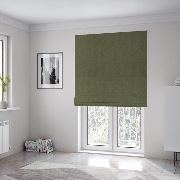 The fabric used to create these Roman blinds is a Merida Suede upholstery fabric in a muted olive green or sage colour.