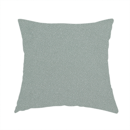 The fabric used to create this handmade cushion is a Merida Suede upholstery fabric in a light sage or pale eucalyptus green colour.