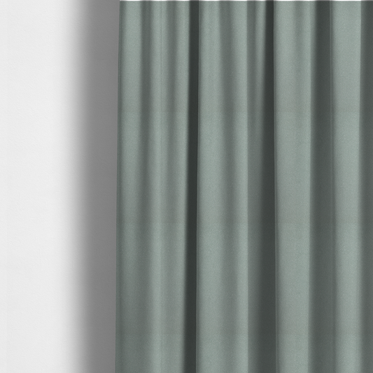 The fabric used to create these made-to-measure curtains is a Merida Suede upholstery fabric in a light sage or pale eucalyptus green colour.