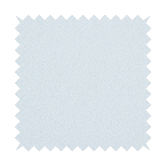 A Merida Suede upholstery fabric in a very pale, off white colour.