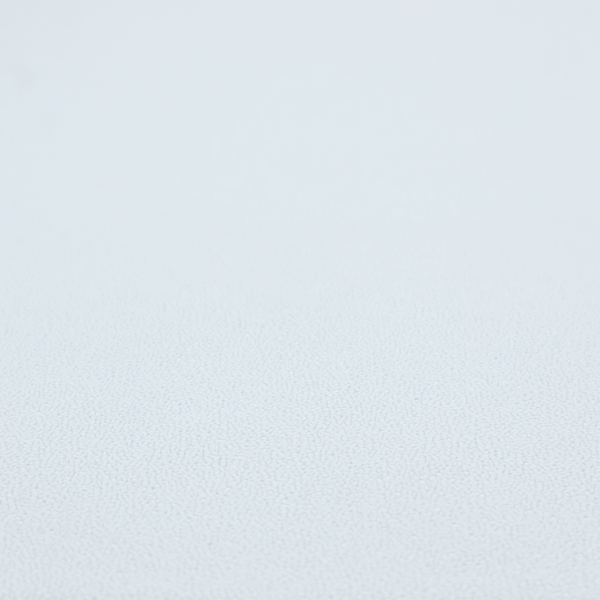 A Merida Suede upholstery fabric in a very pale, off white colour.
