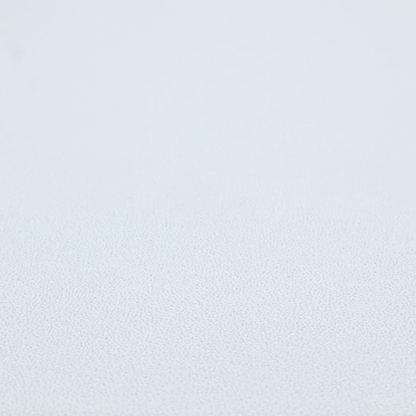 A Merida Suede upholstery fabric in a very pale, off white colour.