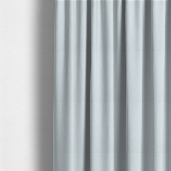 The fabric used to create these made-to-measure curtains is a Merida Suede upholstery fabric in a very pale, off white colour.