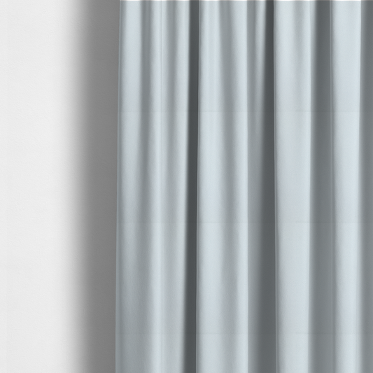 The fabric used to create these made-to-measure curtains is a Merida Suede upholstery fabric in a very pale, off white colour.