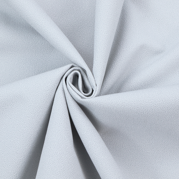 A Merida Suede upholstery fabric in a light silver colour.